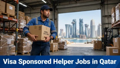 Visa Sponsored Helper Jobs in Qatar male warehouse helper carrying a carton with Doha skyline in background.
